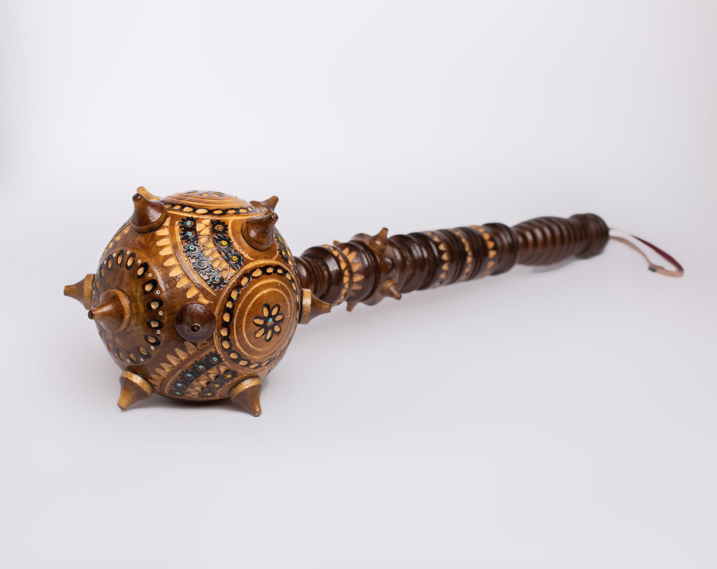 Hand-carved Ukrainian wooden mace, Bulava, showcasing traditional craftsmanship, perfect as a decorative gift or unique keepsake.