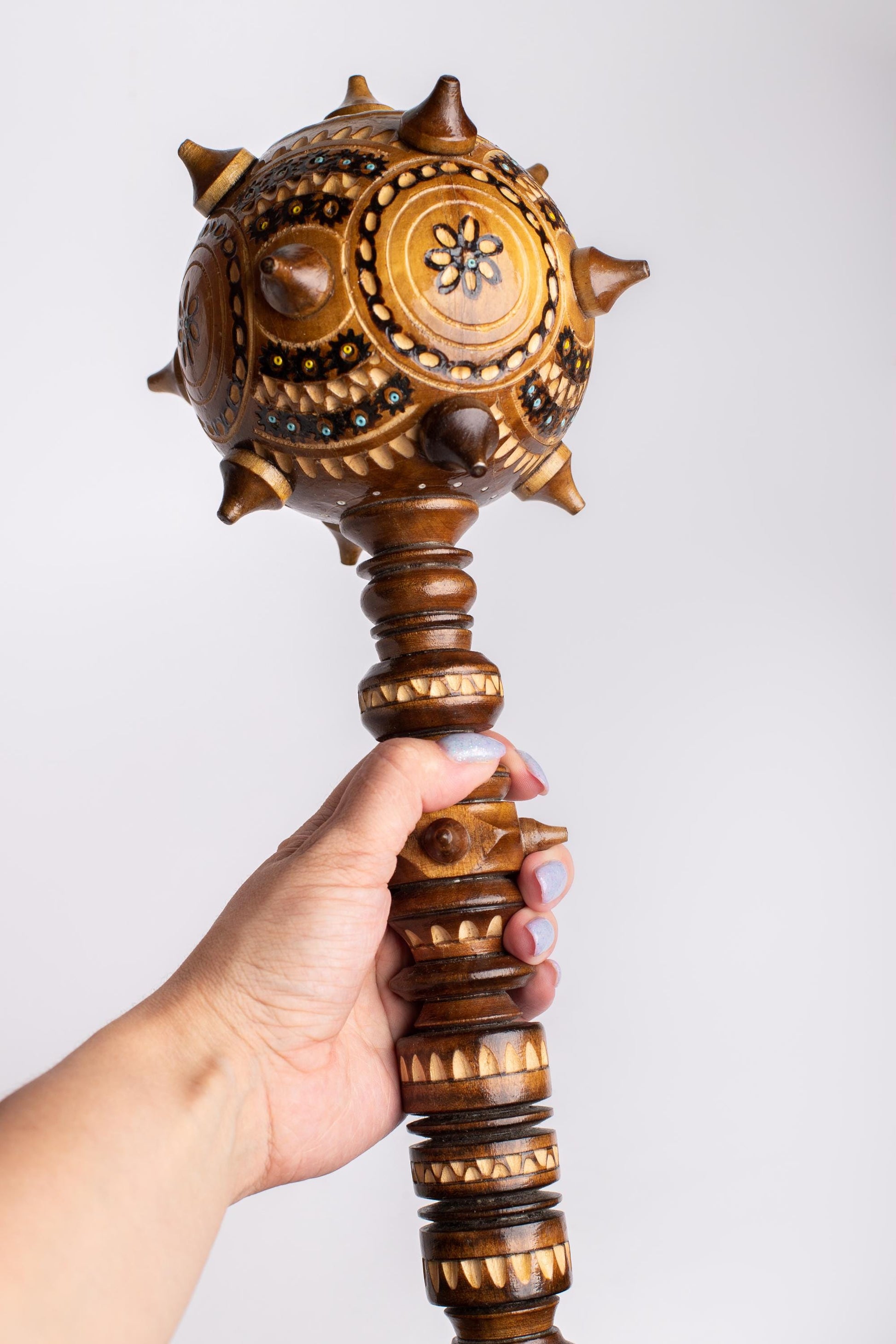 Hand-carved Ukrainian wooden Bulava mace, intricate decorative gift, symbol of strength and heritage.