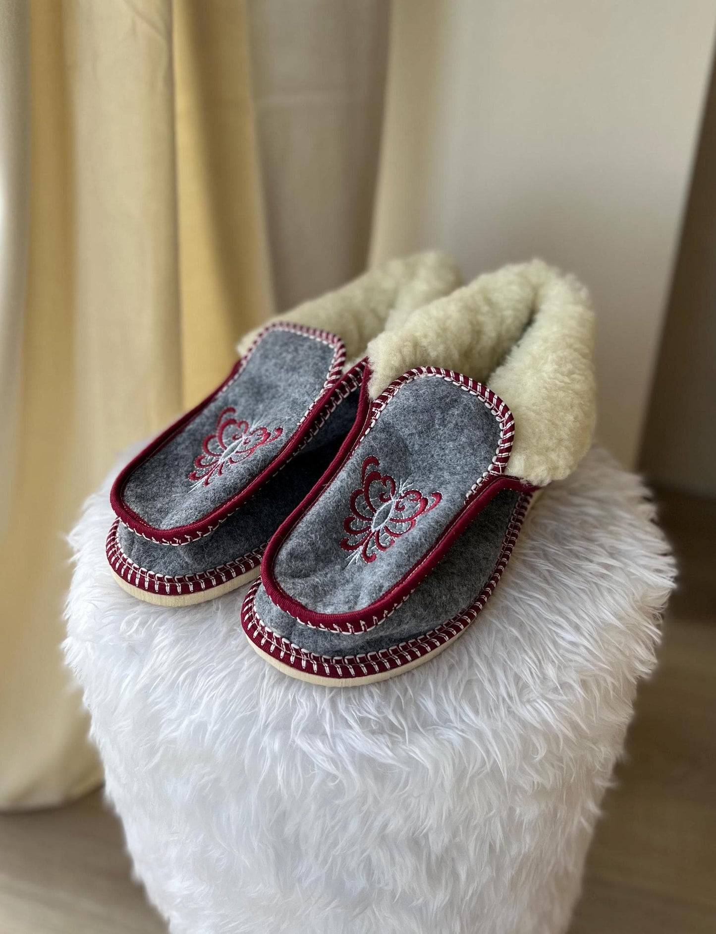 Handmade Carpathian wool slippers with Hutsul embroidery, cozy and stylish, perfect Ukrainian Christmas gift.