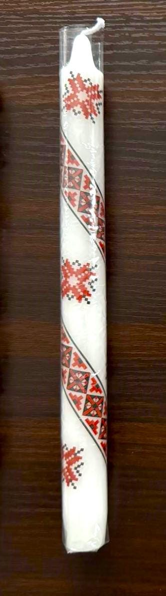 Handmade Ukrainian holiday taper candle with red and white traditional design, perfect for Christmas or Easter decor.