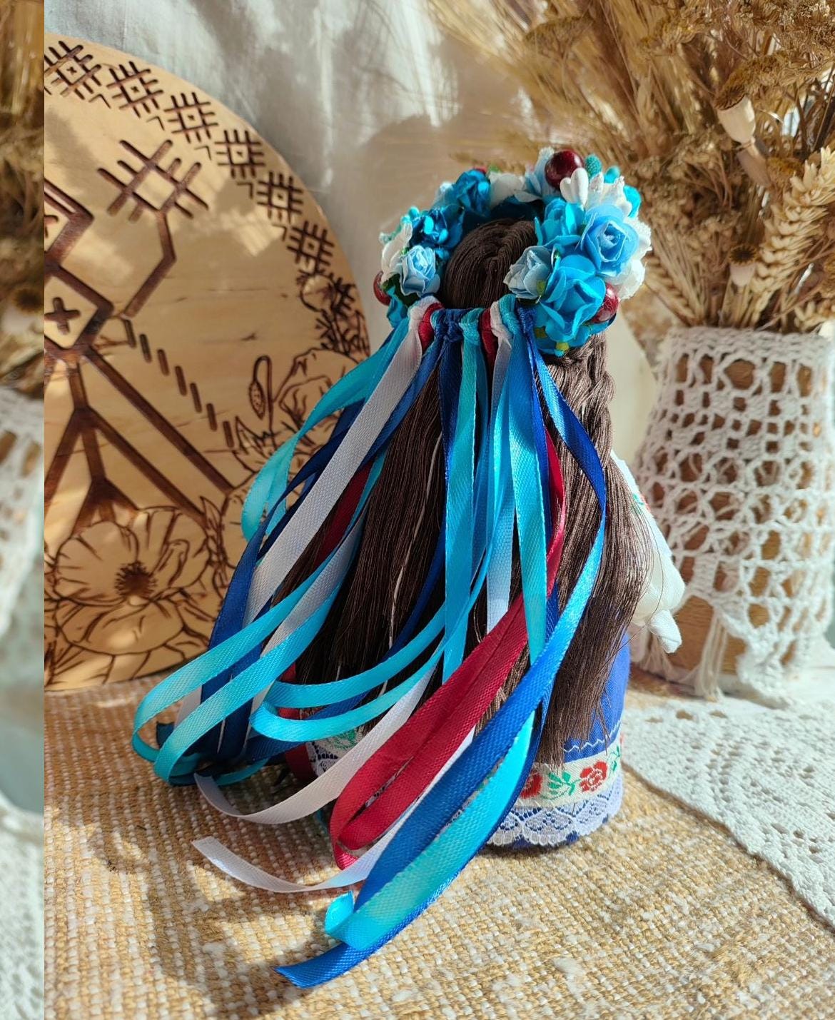 Handmade Ethnic Motanka Doll with Colorful Ribbons and Floral Details, a Symbol of Wisdom and Protection in Home Decor