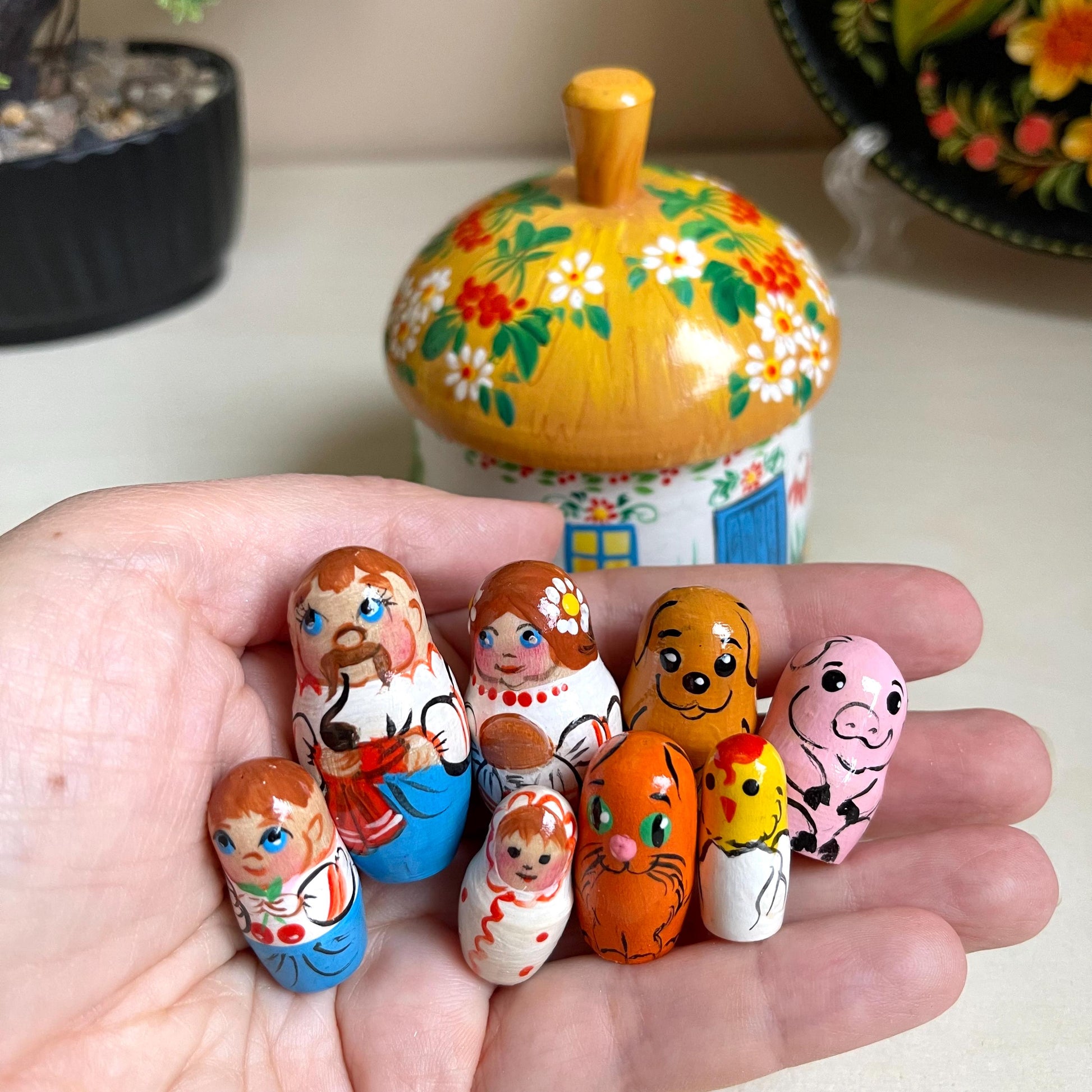 Ukrainian wooden house toy set with hand-painted family dolls, ethnic decorations, ideal for kids' room decor and holiday gifts.