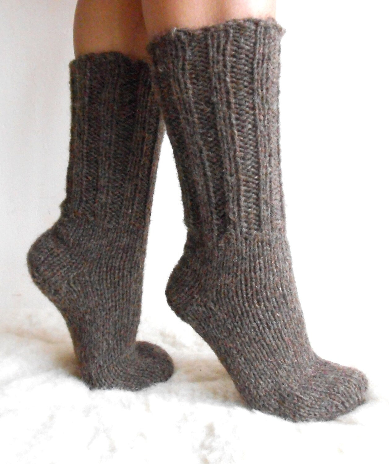 Hand-knitted wool socks in brown, made from 100% pure sheep wool, showcasing softness and warmth for cozy comfort.