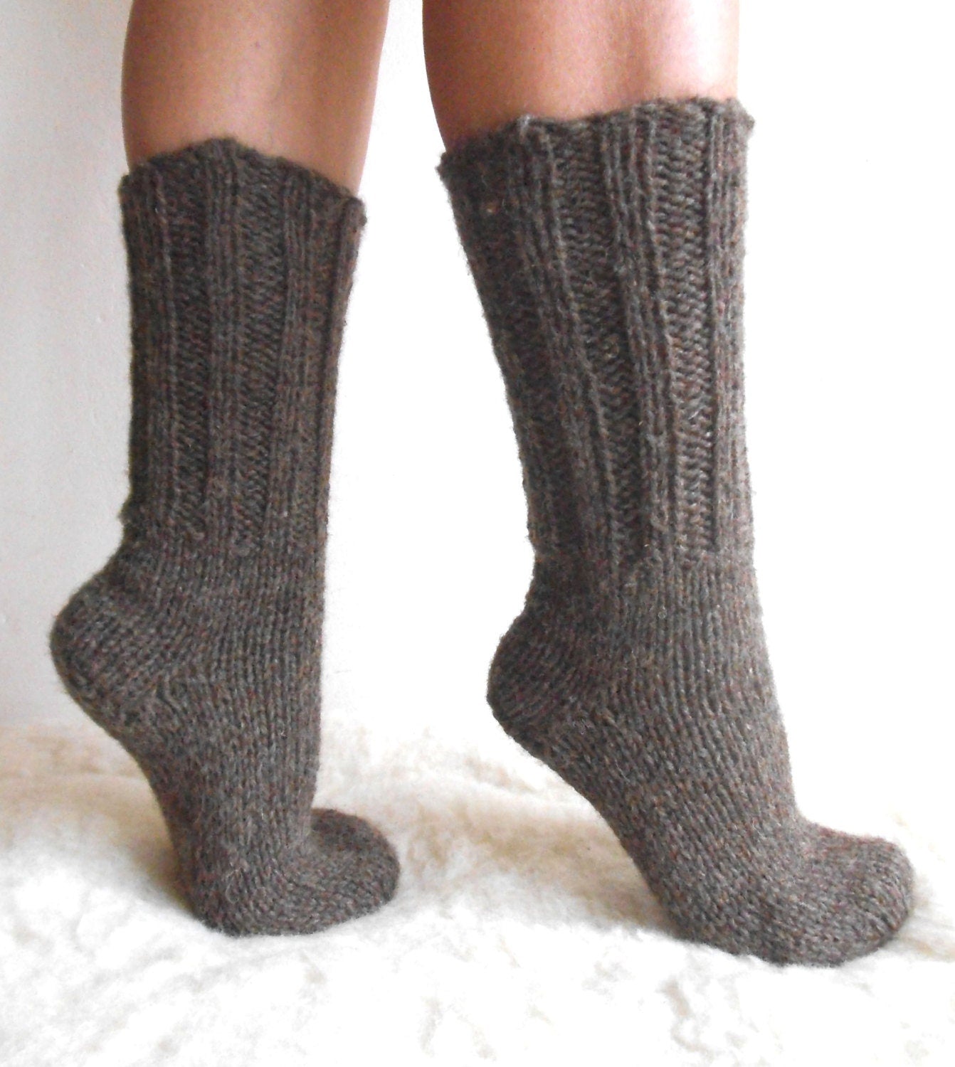 Hand-knitted wool socks made from 100% pure sheep wool, showcasing thick ribbed design, warm and cozy for cold weather.