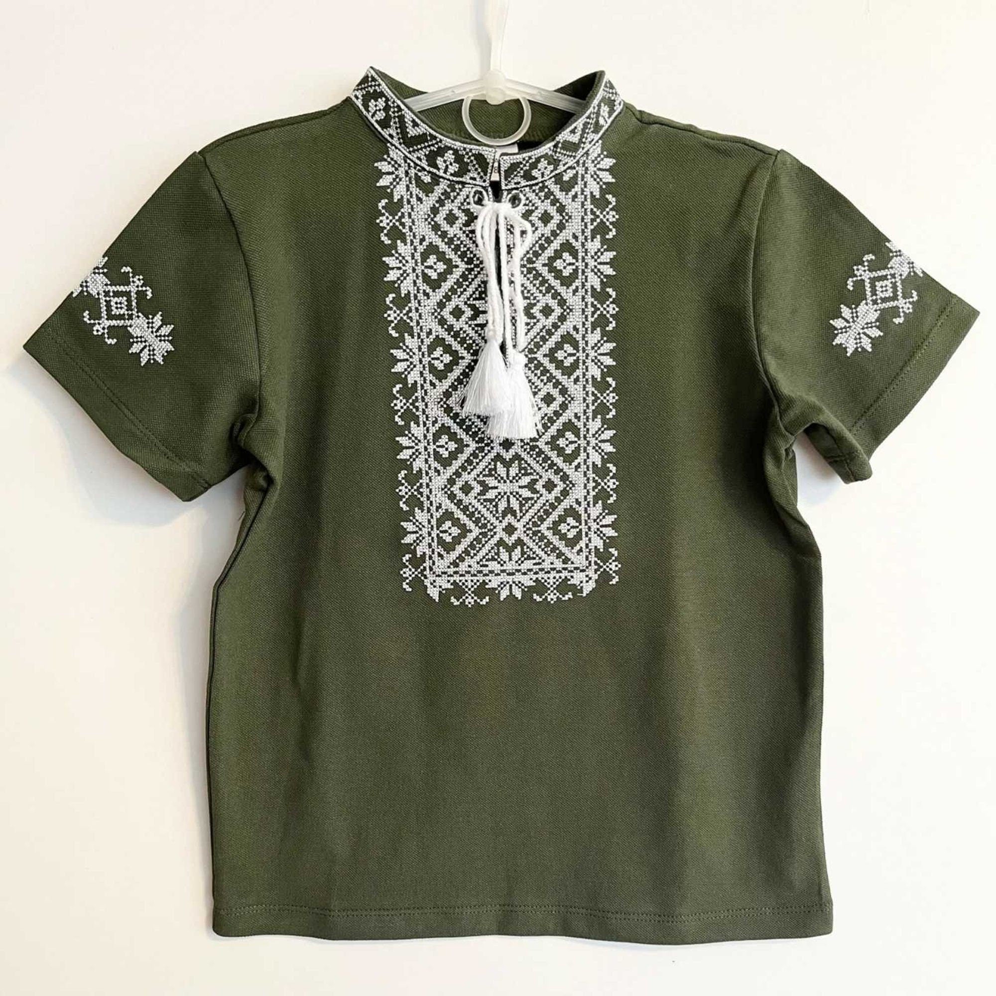 Khaki Ukrainian embroidered boy's shirt with short sleeves and geometric cross-stitch, suitable for ages 4-13.