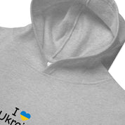 Kids Fleece Hoodie with "I Love Ukraine" design, showcasing soft, durable fabric and cozy hood, perfect for children's adventures.