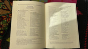 Open pages of 'Kobzar' by Taras Shevchenko in English, featuring the poem 'Kateryna' on a colorful patterned background.