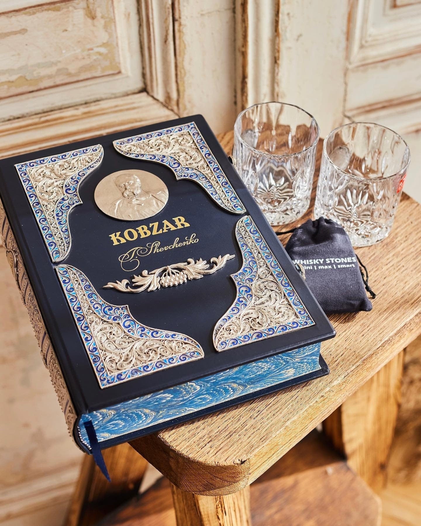 Luxury handmade edition of 'Kobzar' by Taras Shevchenko with leather binding, gilding, and silver detailing.