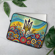 Ukrainian Folk Art Laptop Sleeve with Tryzub Emblem and Colorful Floral Design on Concrete Background