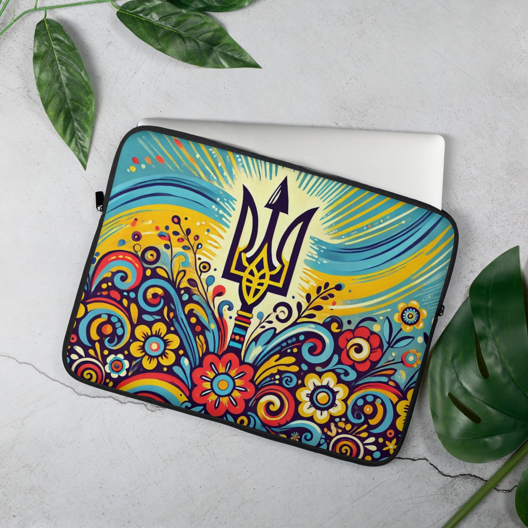 Ukrainian Folk Art Laptop Sleeve with Tryzub Emblem and Colorful Floral Design on Concrete Background