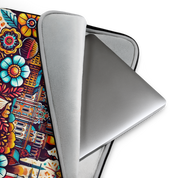 "Kyiv Folk Art Laptop Sleeve with Tryzub, water-resistant neoprene case with floral design, open to reveal a laptop"