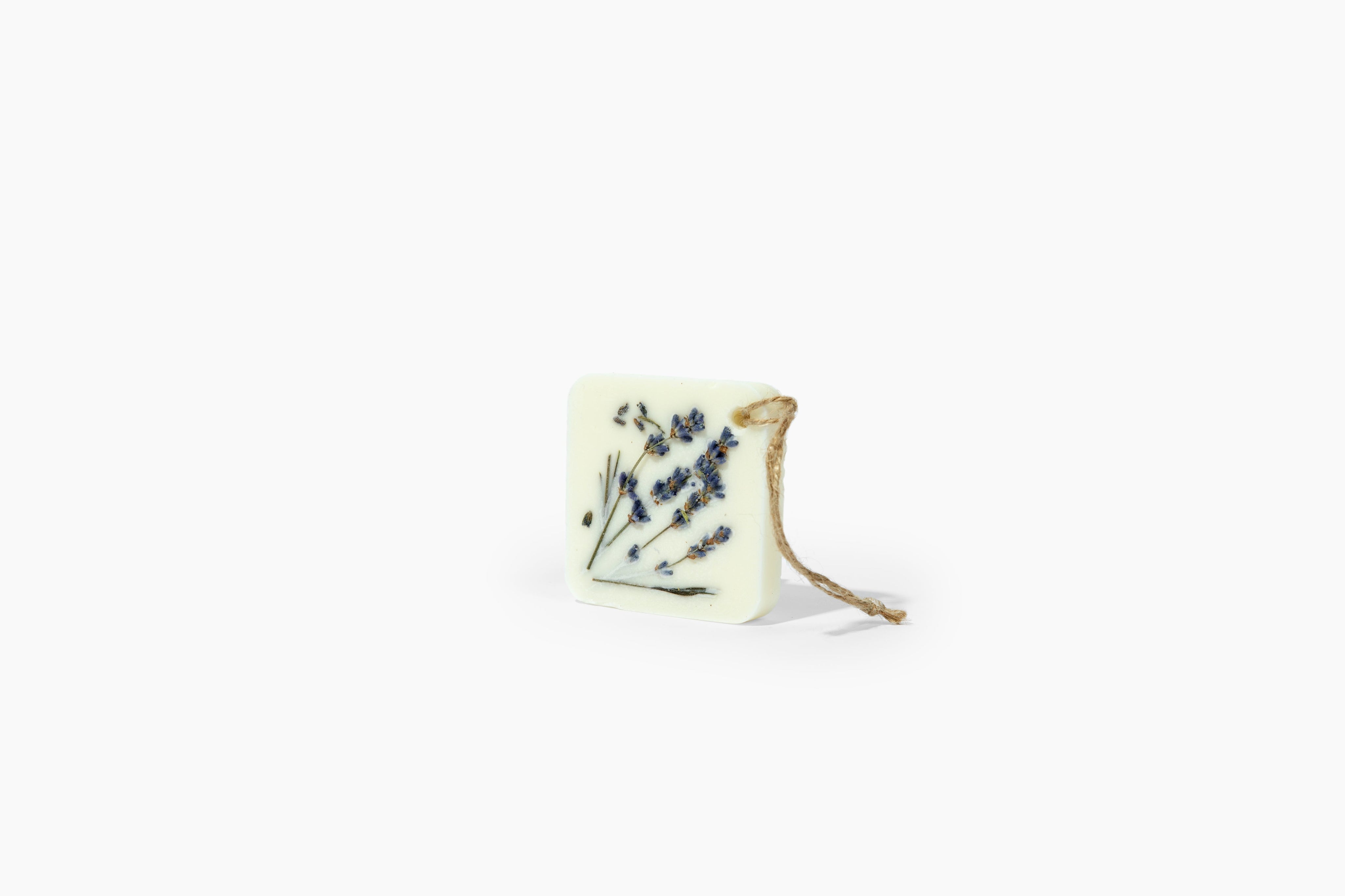 Lavandelle Botanical Wax Sachet with dried lavender flowers, soy wax, and essential oil for natural aromatic fragrance in spaces.