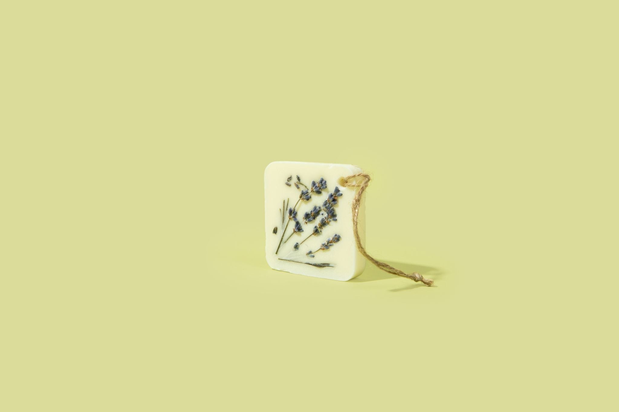 Lavandelle Botanical Wax Sachet with dried lavender on a light background, eco-friendly aroma for home and closet spaces.