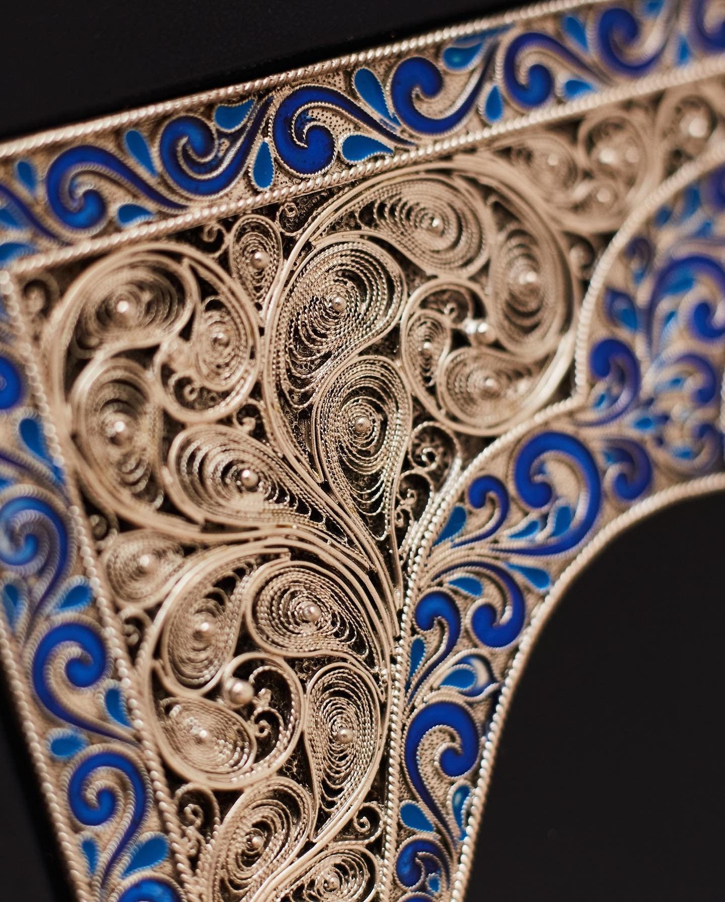 Intricate copper overlay with blue enamel from luxury handmade edition of 'Kobzar' by Taras Shevchenko, leather-bound book.