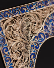 Intricate copper overlay with blue enamel from luxury handmade edition of 'Kobzar' by Taras Shevchenko, leather-bound book.