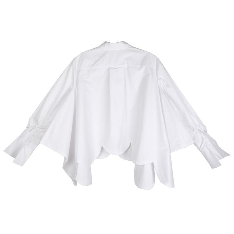 Valcira Irregular Hem Shirt with asymmetrical design and turn-down collar in soft jersey cotton, shown from the back.