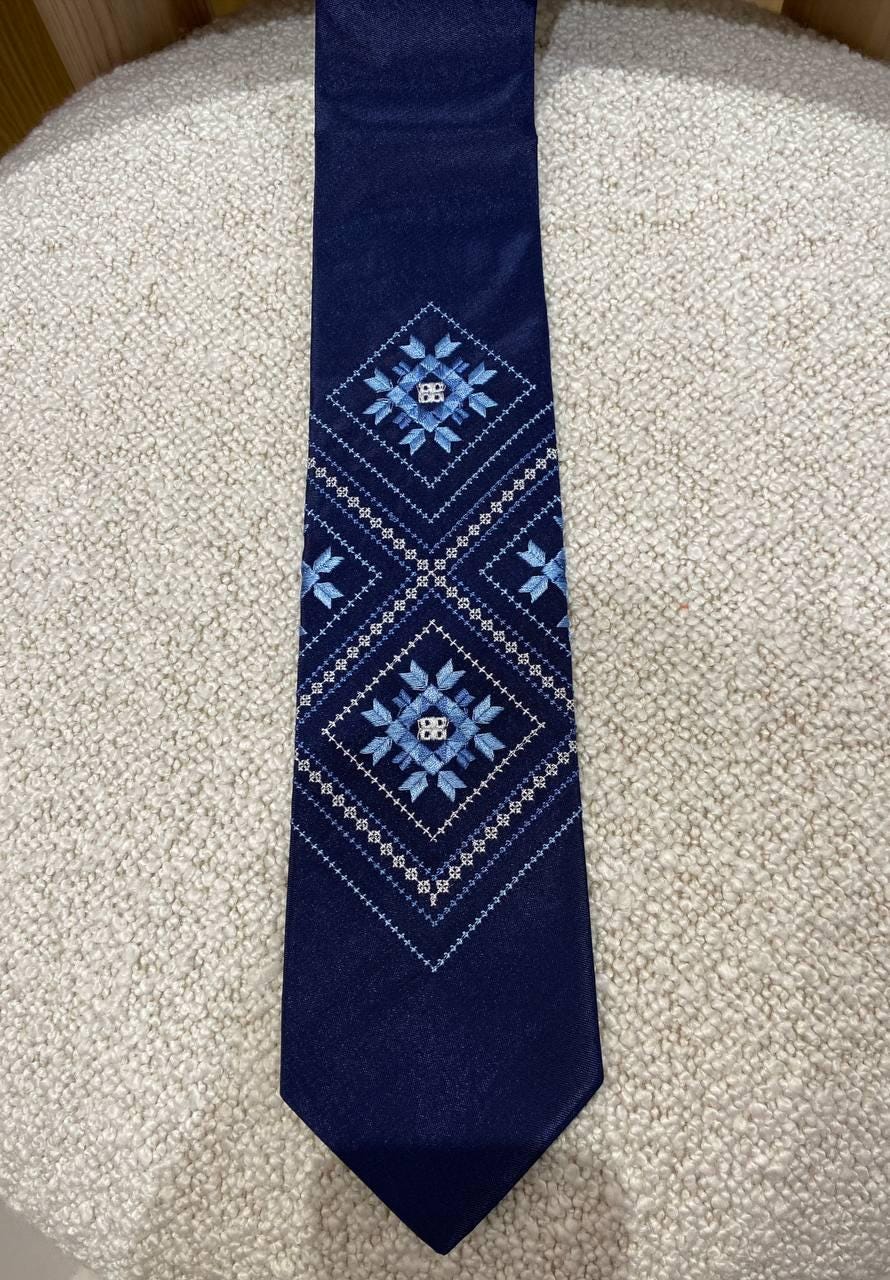 Men's blue embroidered tie with Ukrainian folk pattern, dark blue fabric, perfect gift for him on formal or traditional occasions.