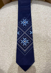 Men's blue embroidered tie with Ukrainian folk pattern, dark blue fabric, perfect gift for him on formal or traditional occasions.