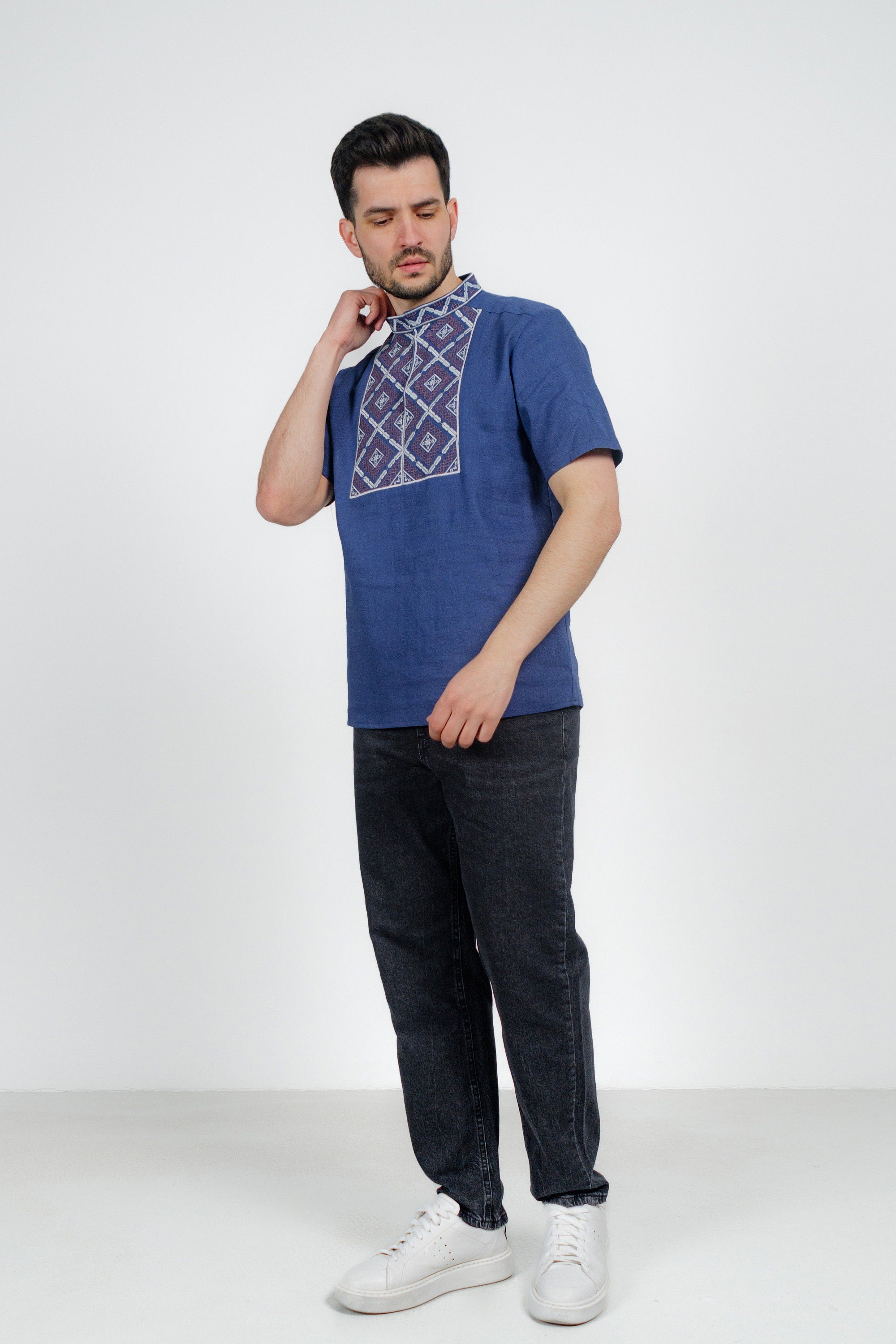 Men's blue short sleeve Ukrainian Vyshyvanka shirt with geometric embroidery, made of breathable linen-cotton blend.