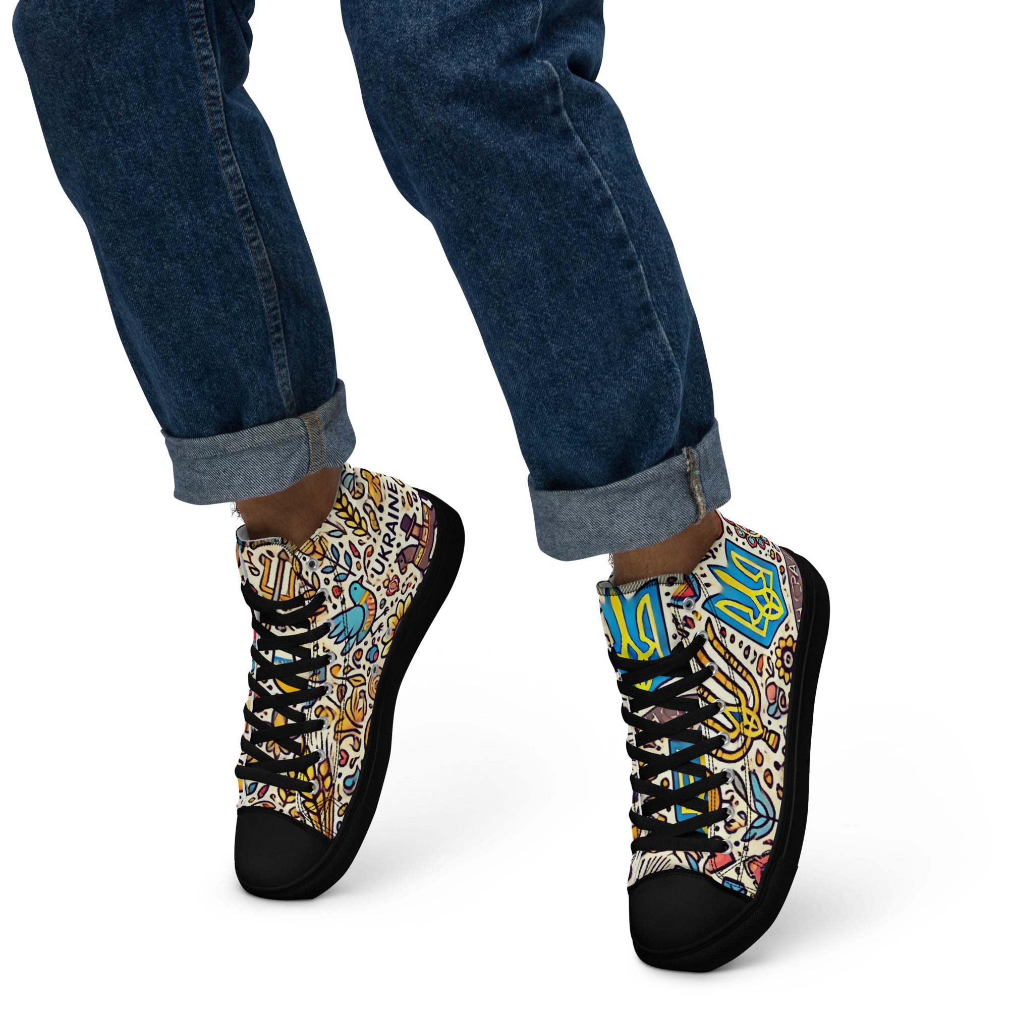 High top canvas shoes with Ukrainian symbolic design, faux leather toe cap, and lace-up front, worn with rolled-up jeans.