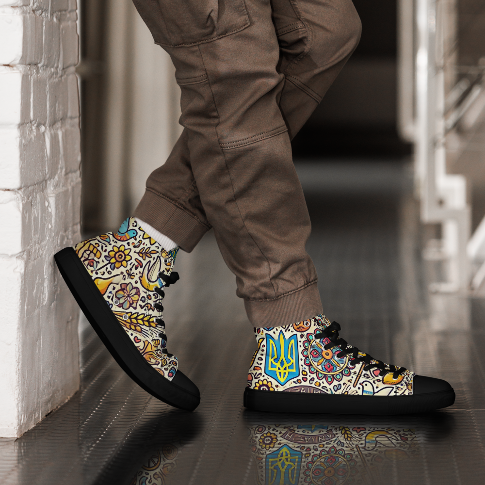 Person wearing high top canvas shoes with Ukrainian symbolic design, featuring a faux leather toe cap and lace-up front.