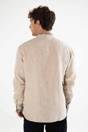 Back view of men's linen shirt with Ukrainian embroidery and folk motif