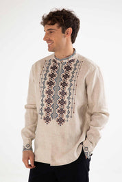 Men's linen shirt with Ukrainian folk embroidery, featuring traditional designs and a stand-up collar, made from natural linen.