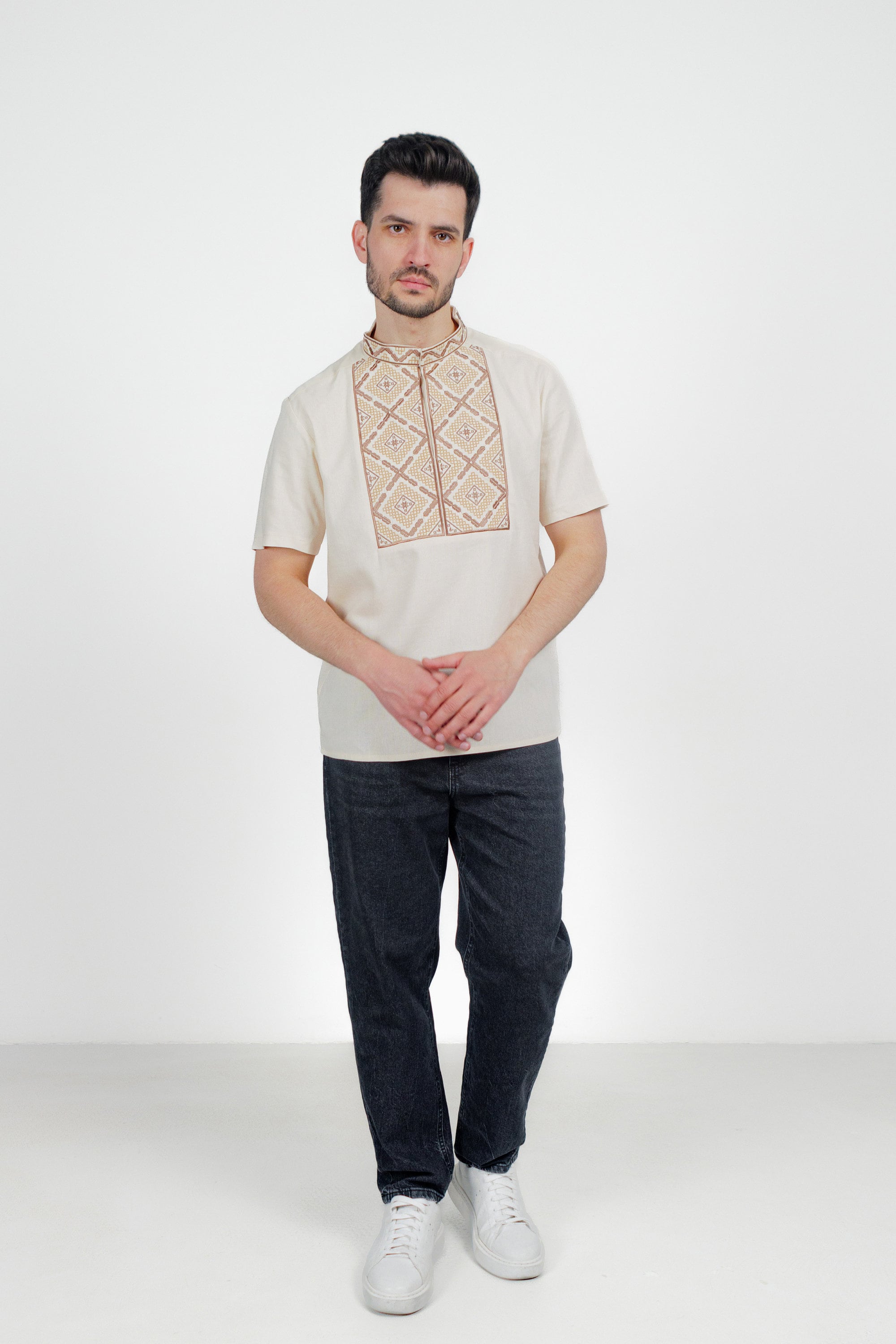 Men's short sleeve Ukrainian embroidered shirt, linen vyshyvanka with geometric pattern, ideal gift for him, displayed on a model.
