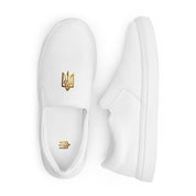 White slip-on canvas shoes with gold Ukrainian Trizub design, featuring breathable lining and padded collar for comfort.