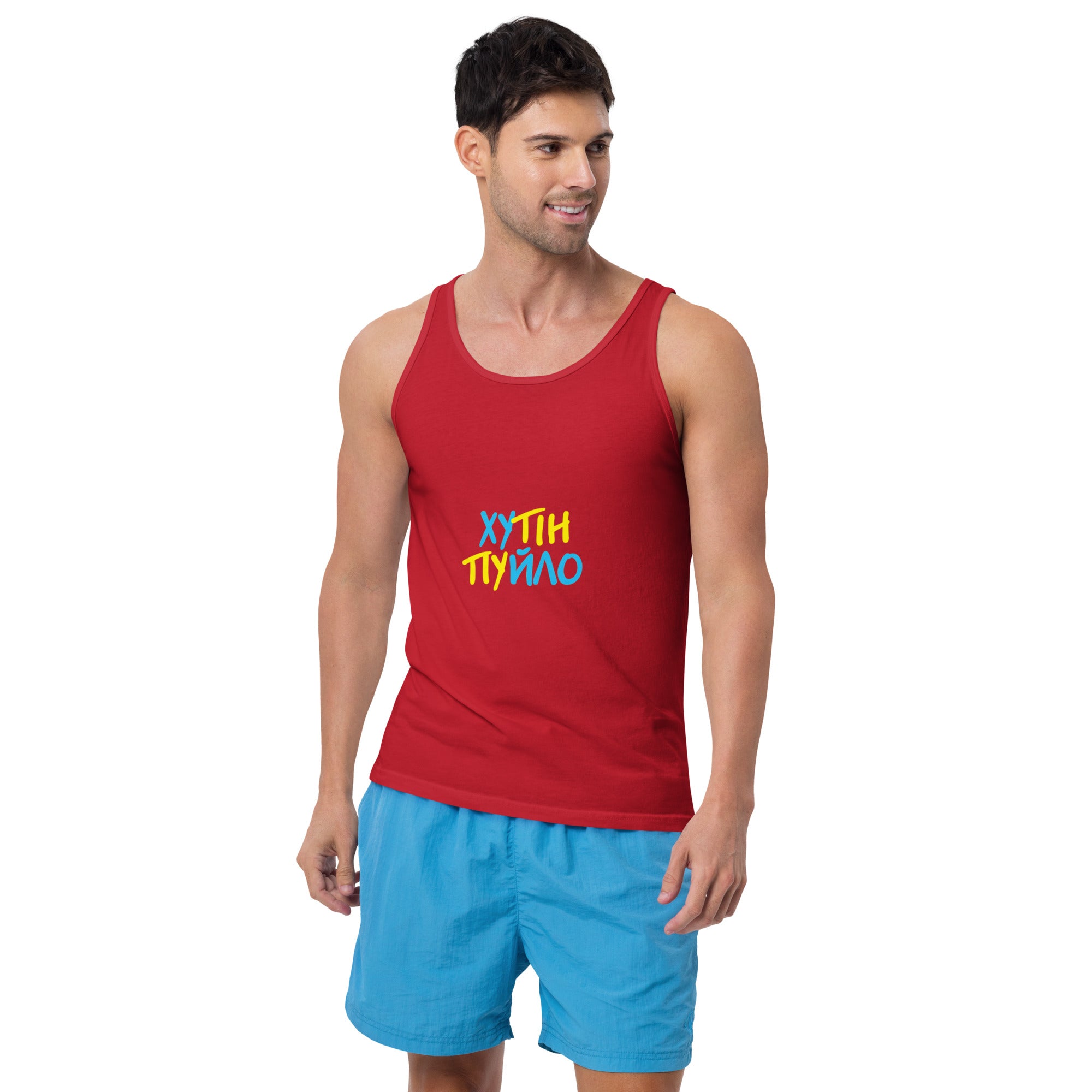 Man wearing Ukrainian men's tank top 'ХУТІН ПУЙЛО' with trident logo, red color, promoting bold Ukrainian pride.