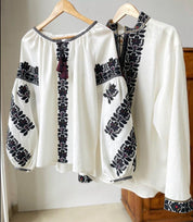 Men's white linen Ukrainian vyshyvanka with traditional black embroidery, ideal as an ethnic gift or Easter outfit.