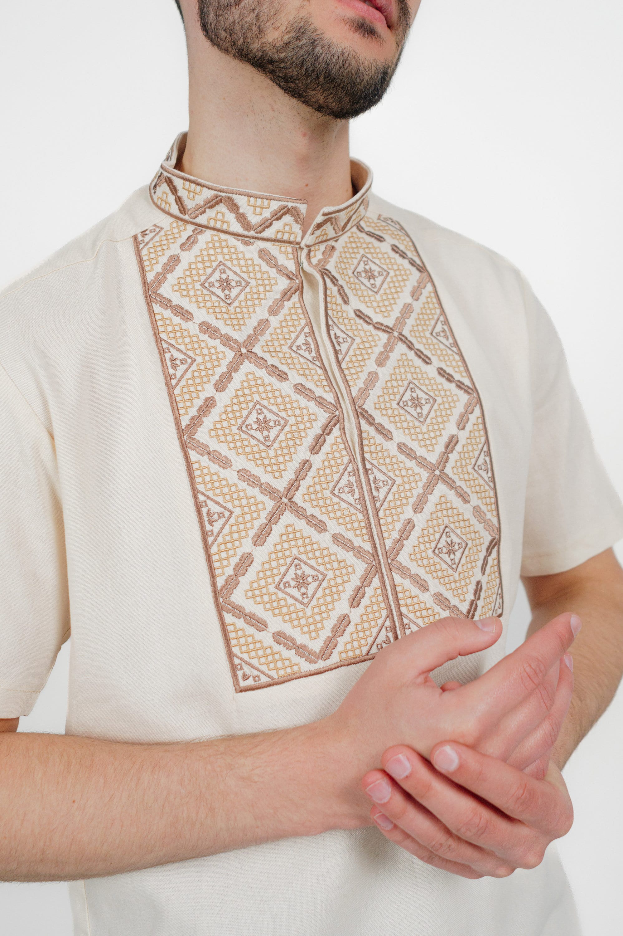 Men's short sleeve Ukrainian vyshyvanka shirt in linen with geometric embroidery pattern.