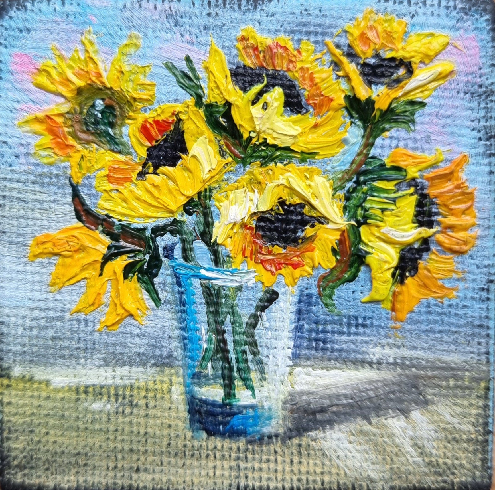 Hand-painted miniature sunflower oil painting, Ukrainian art, 2x2 inch masterpiece on easel, symbolizing hope and resilience.
