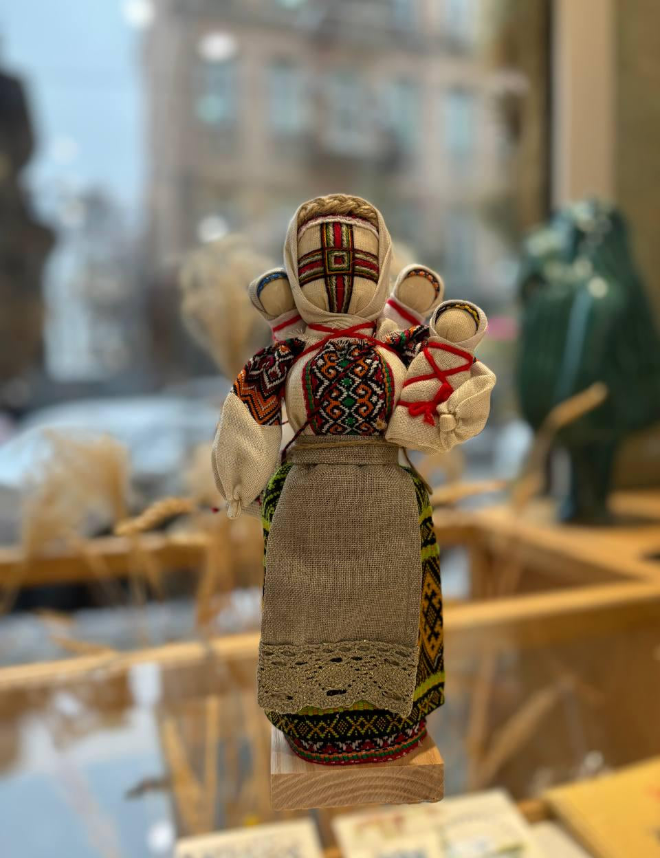 Handmade Ukrainian Motanka doll 'Many' with symbolic children, a protective and cultural gift for prosperity and family harmony.