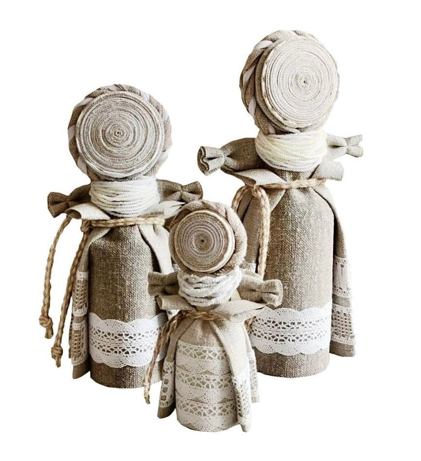 Handmade Ukrainian Motanka Dolls 'Eye of the Family'; linen and wood; symbolizing family protection and ancestral connection.