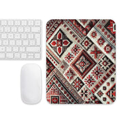 Ukrainian carpet-inspired mouse pad with traditional patterns next to a keyboard and mouse, enhancing desk style and functionality.