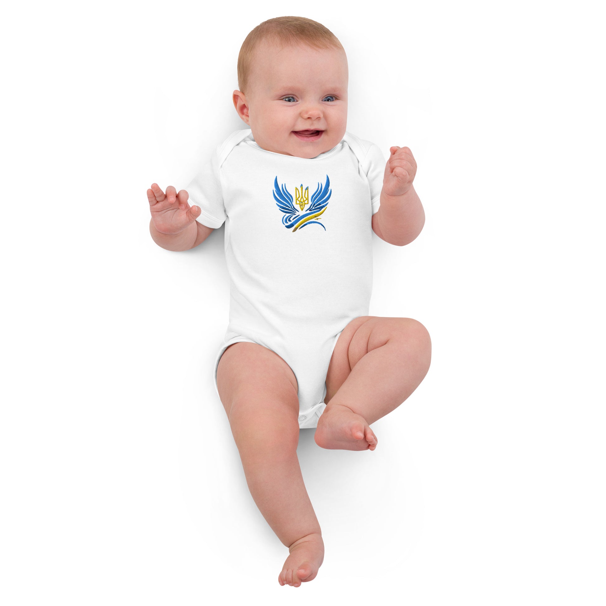 Baby wearing organic cotton bodysuit with Ukrainian Tryzub logo, showcasing heritage and comfort.