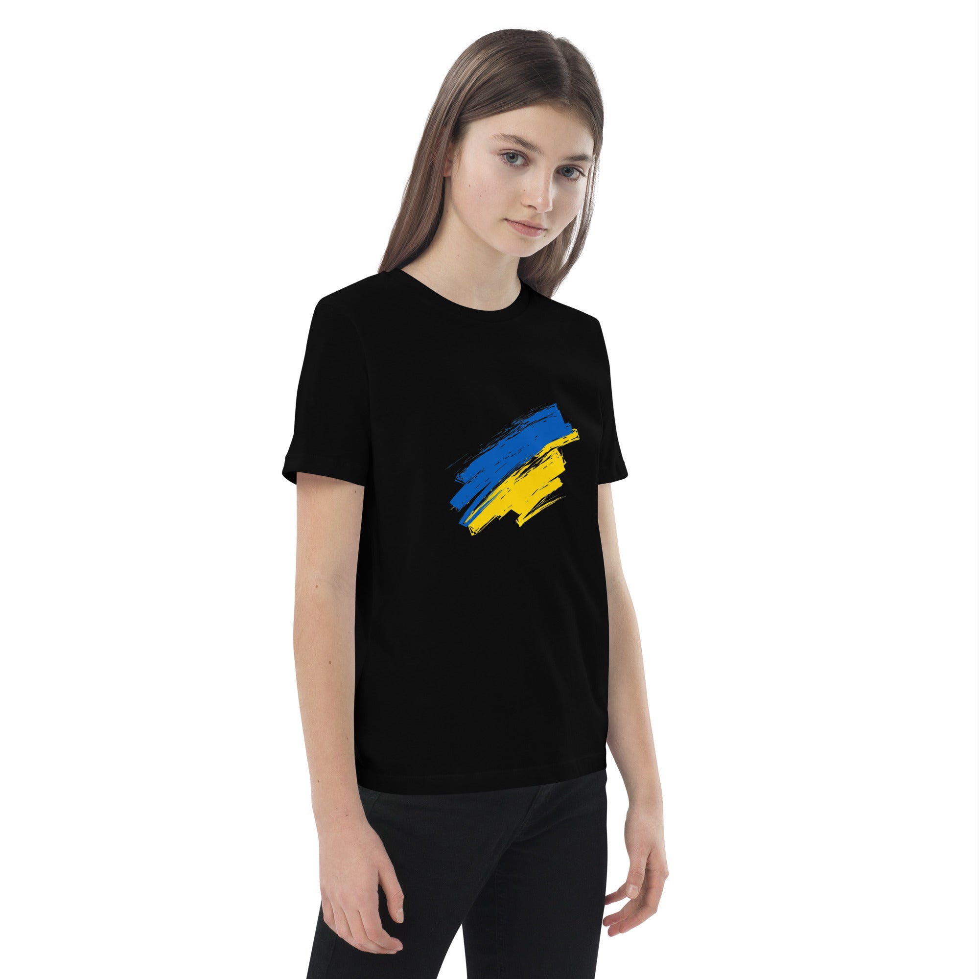Girl wearing organic cotton kids' t-shirt with Ukrainian flag design, eco-friendly and stylish attire for patriotic kids.