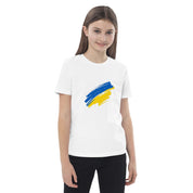 Girl wearing organic cotton t-shirt with Ukrainian flag design, showcasing patriotism and eco-friendly style.