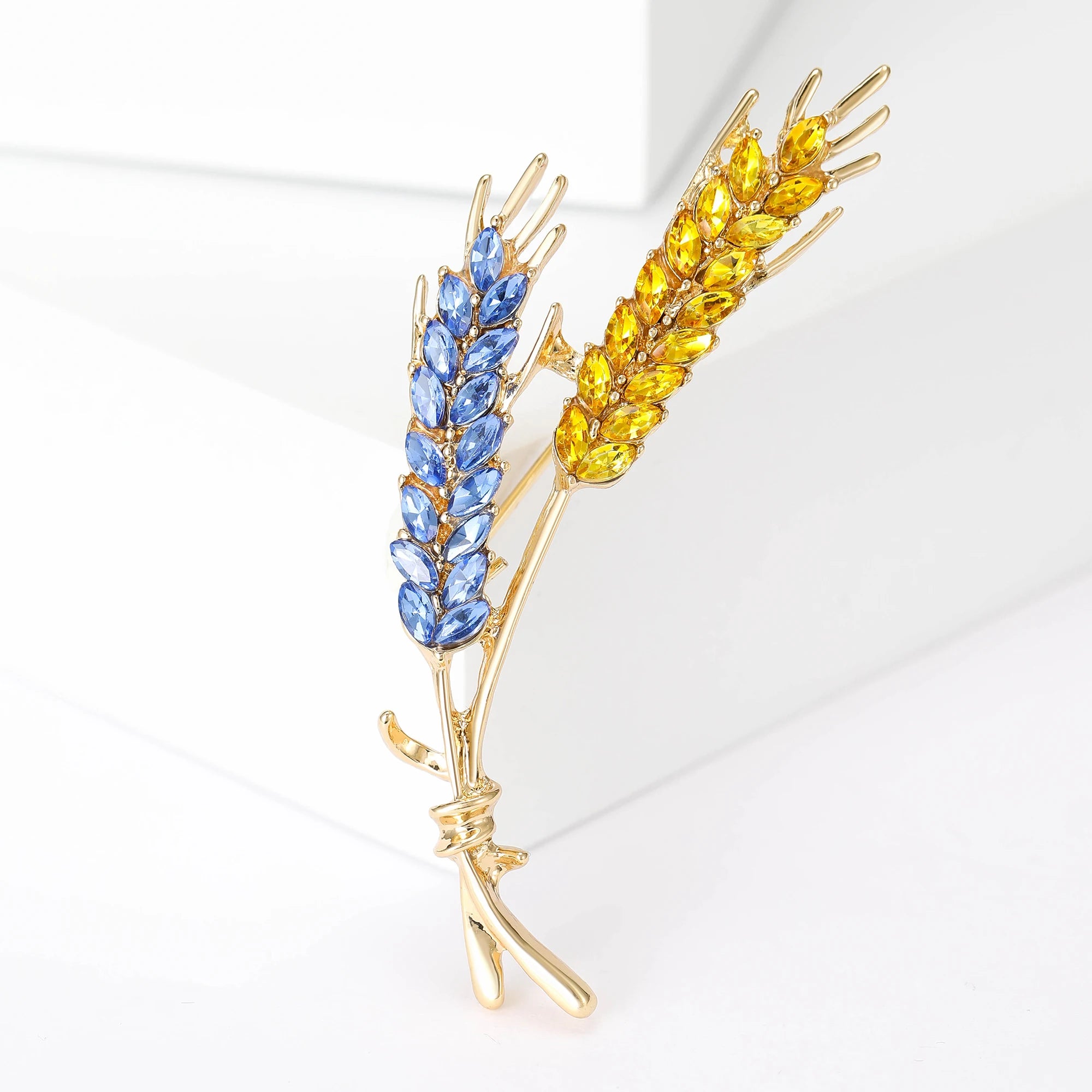 Patriotic Ukrainian wheat brooch in blue and yellow, symbolizing heritage, handcrafted elegance, and intricate detailing.