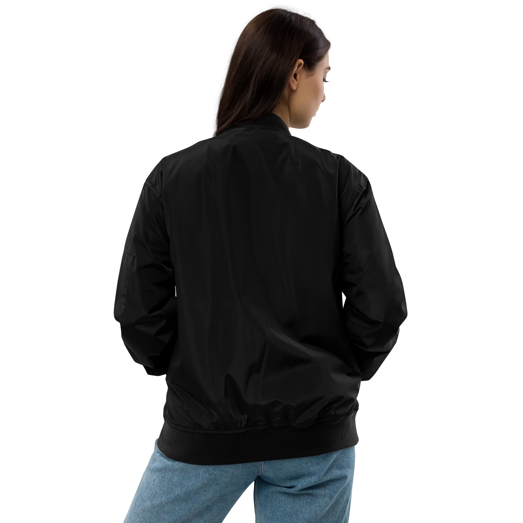 Back of model wearing Ukrainian Premium Recycled Bomber Jacket in black, showcasing eco-friendly design and relaxed fit.