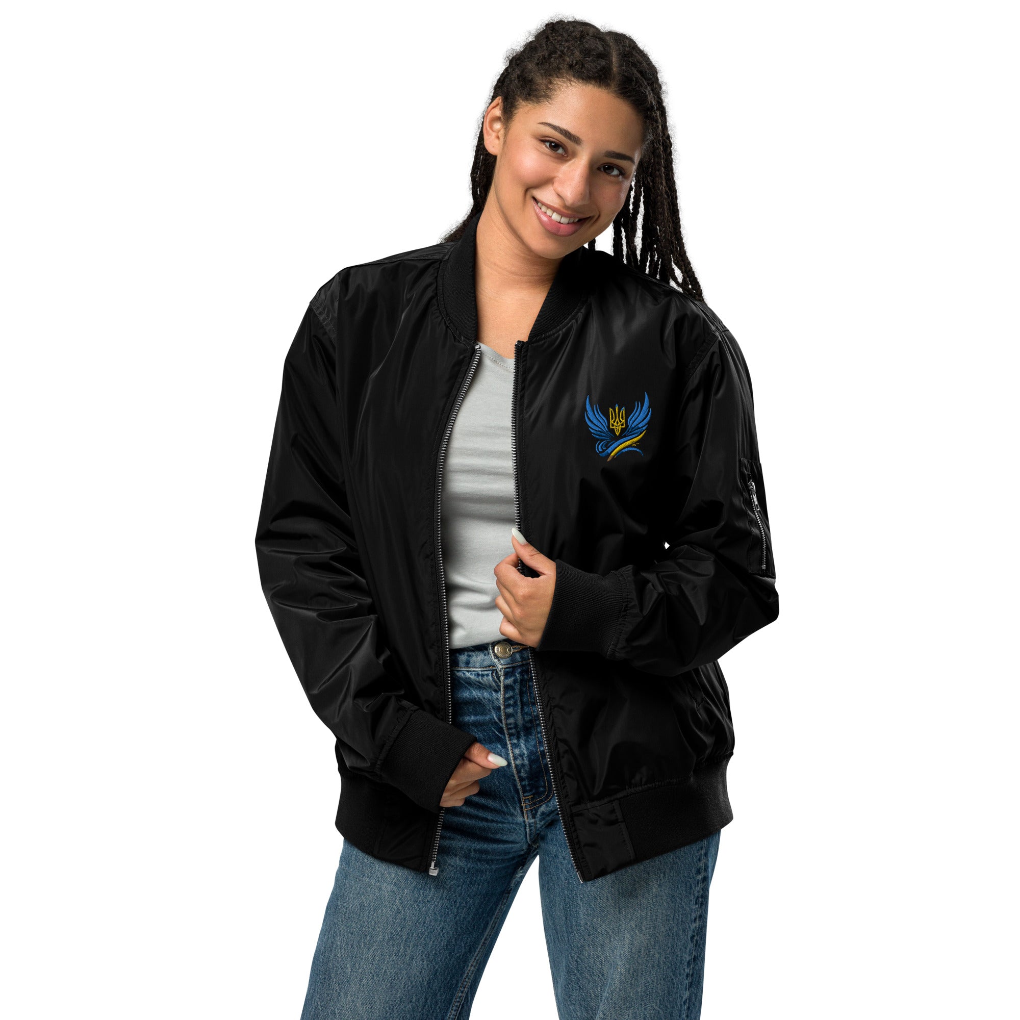 Woman wearing Ukrainian premium recycled bomber jacket with Trizub emblem, eco-friendly, made from 100% recycled polyester for versatile style.