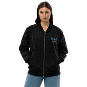 Model wearing Ukrainian Premium Recycled Bomber Jacket, black with blue Trizub emblem, eco-friendly, stylish and versatile unisex fit.