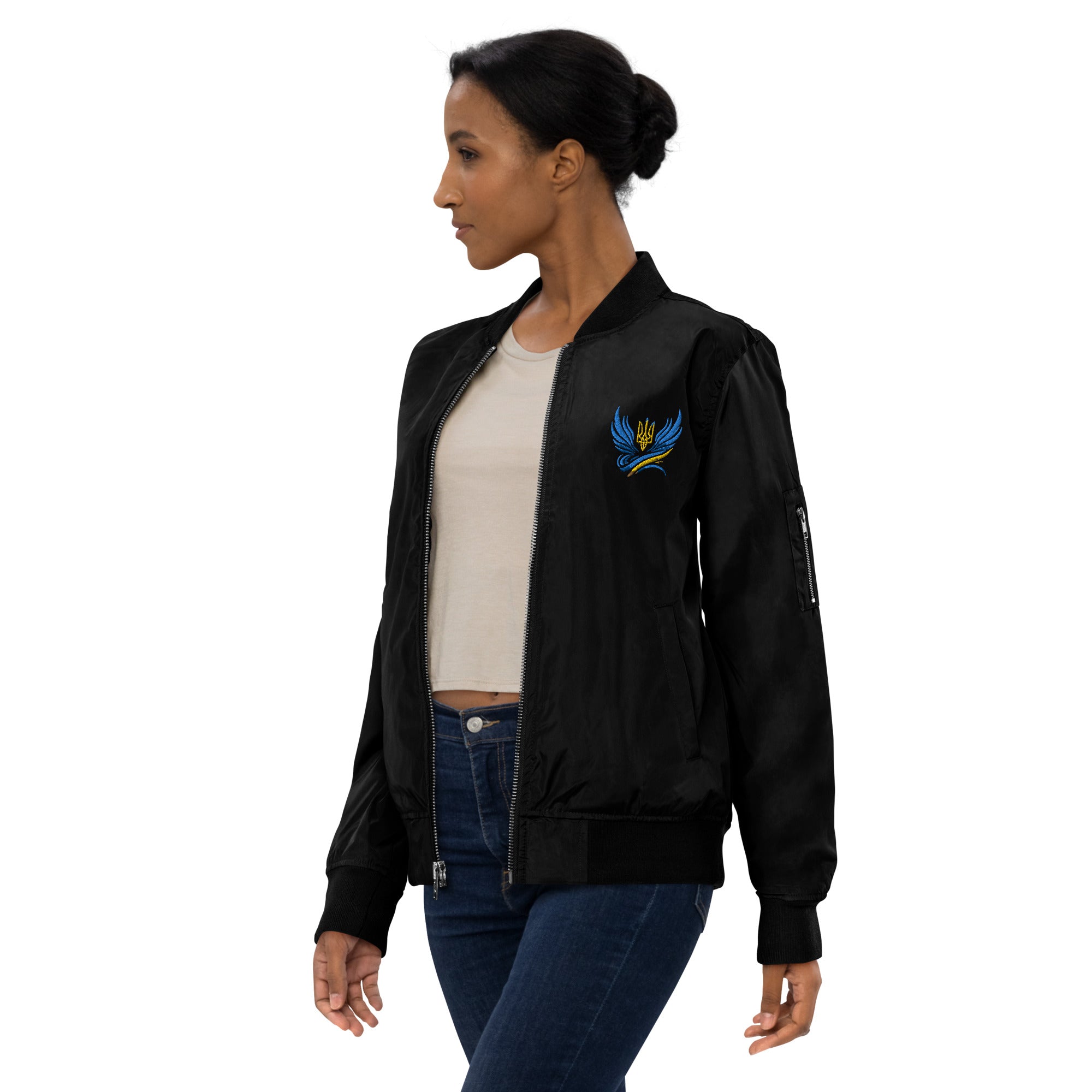 Model wearing Ukrainian premium recycled bomber jacket in black with crest embroidery, eco-friendly and stylish design.