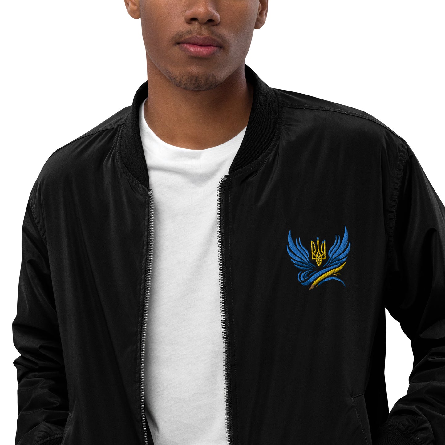 Man wearing Trizub Collection black bomber jacket with Ukrainian emblem embroidery