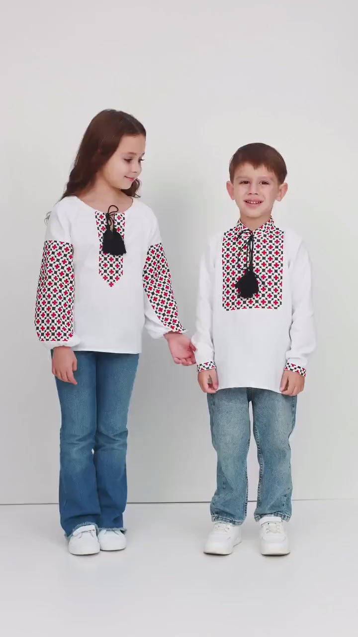 Children wearing Ukrainian embroidered blouses in traditional Vyshyvanka style, featuring ethnic patterns and tassels.