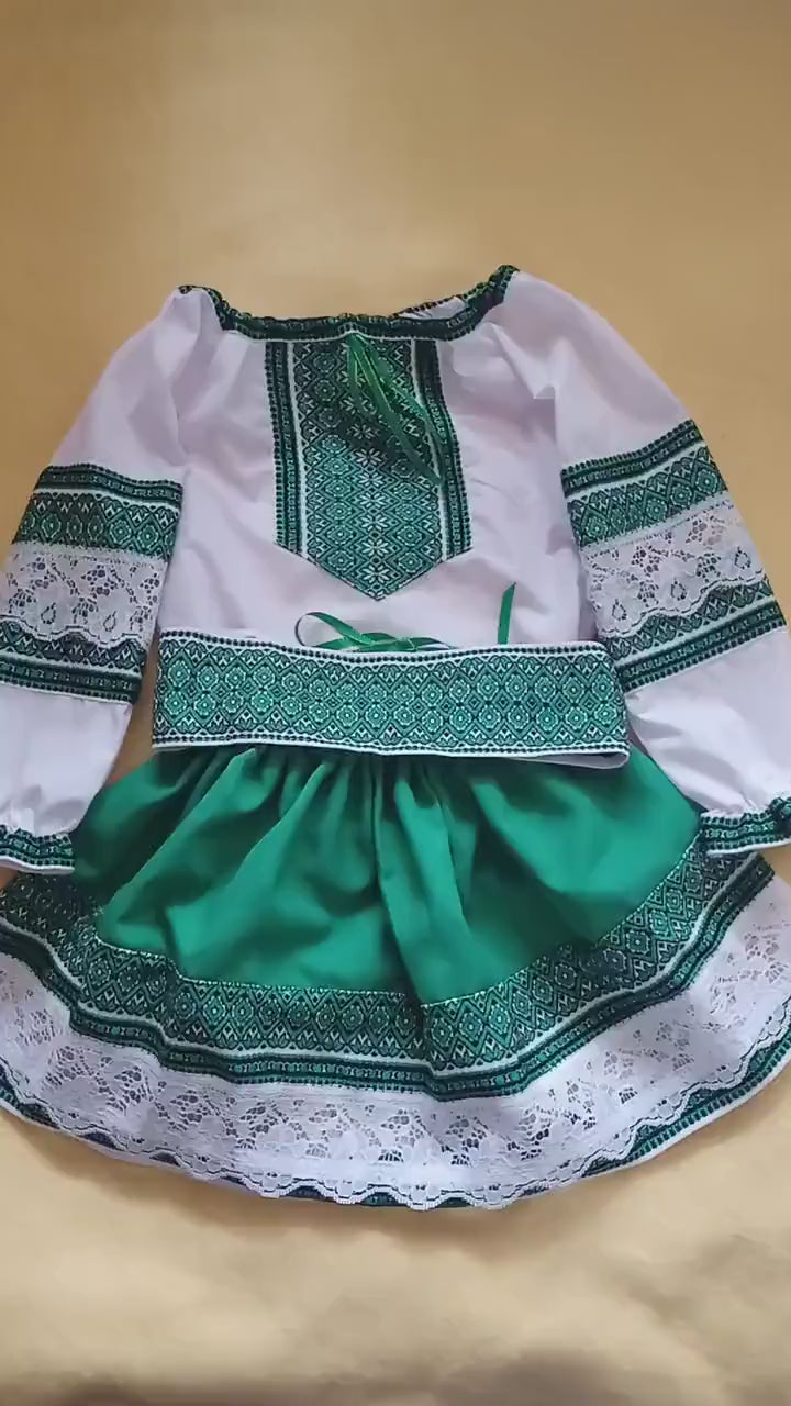 Traditional green Ukrainian embroidered blouse and skirt set for girls.