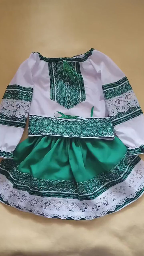 Traditional green Ukrainian embroidered blouse and skirt set for girls.