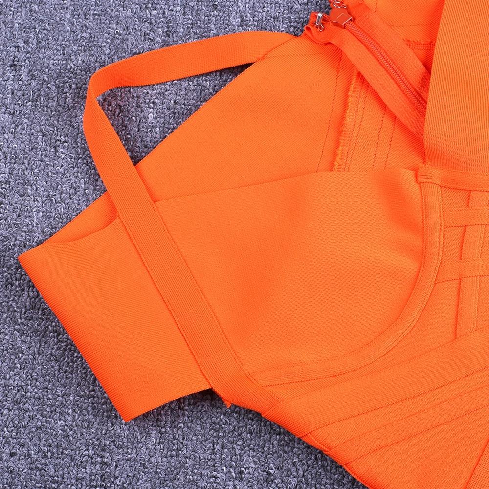 Close-up of Nysara Off-Shoulder Bandage Dress in vibrant orange, showcasing its bandage knit texture and off-shoulder strap design.