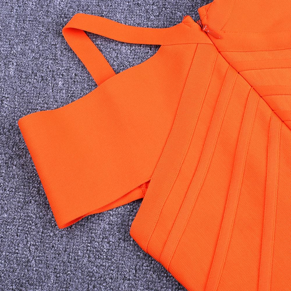 Close-up of Nysara Off‑Shoulder Bandage Dress with orange bandage knit and off-shoulder straps, highlighting the fabric texture.